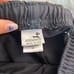 Black board shorts with blue detail