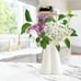 Unique white ceramic hand vase