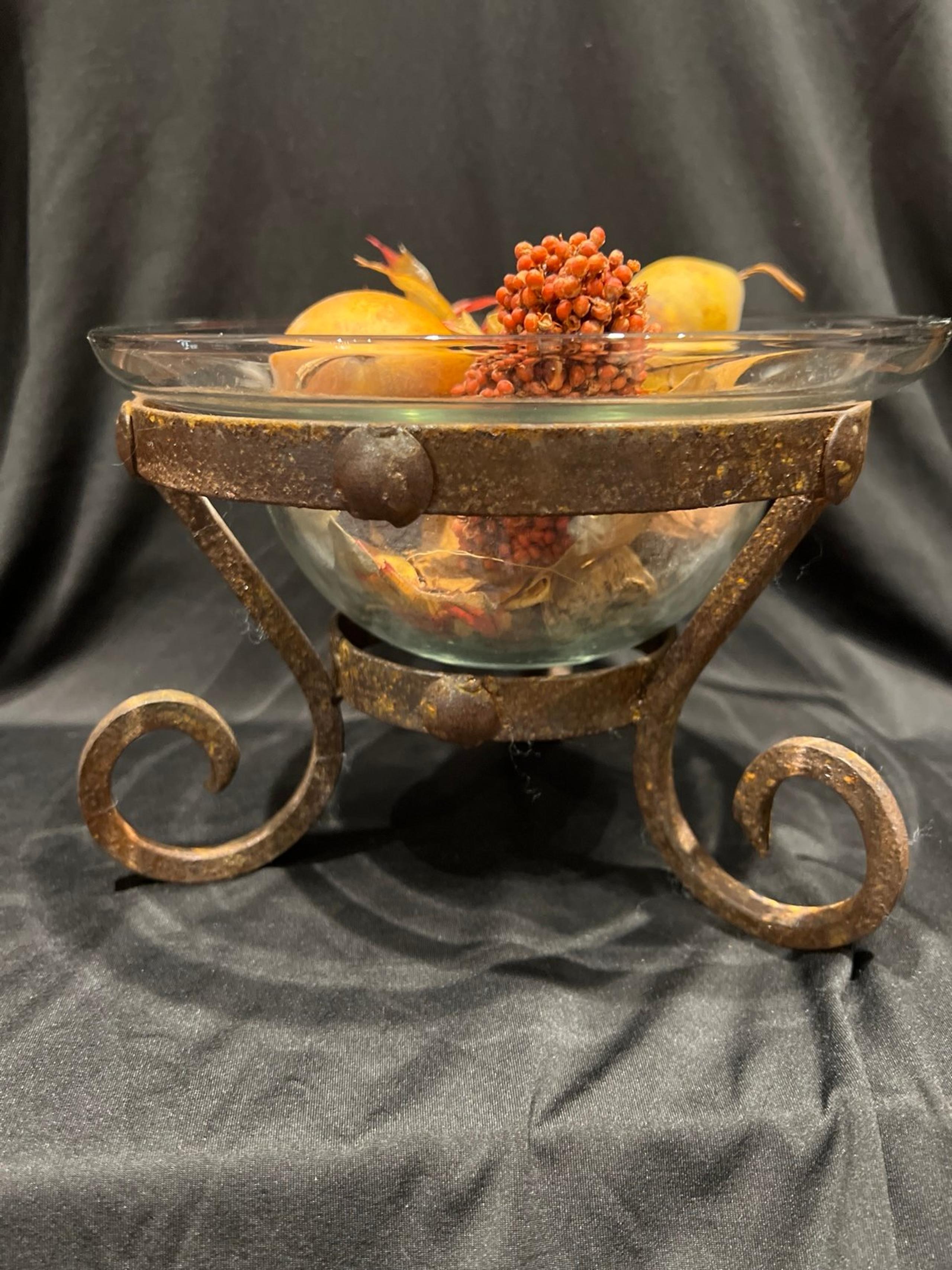 Vintage glass bowl in decorative iron stand