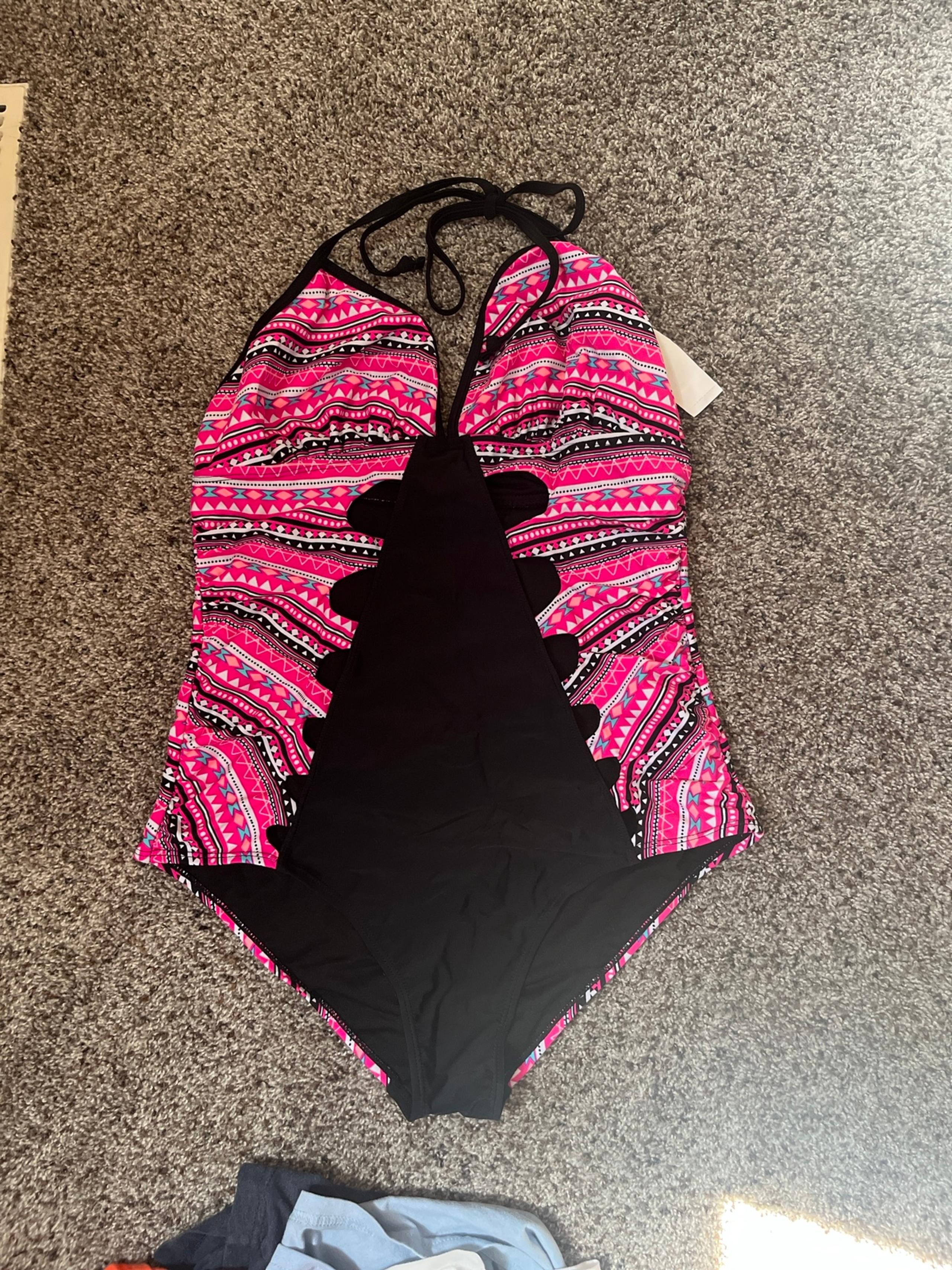 One Piece with cut outs size large NWT
