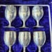 Silver plated goblet shot glasses and a serving dish