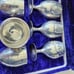 Silver plated goblet shot glasses and a serving dish