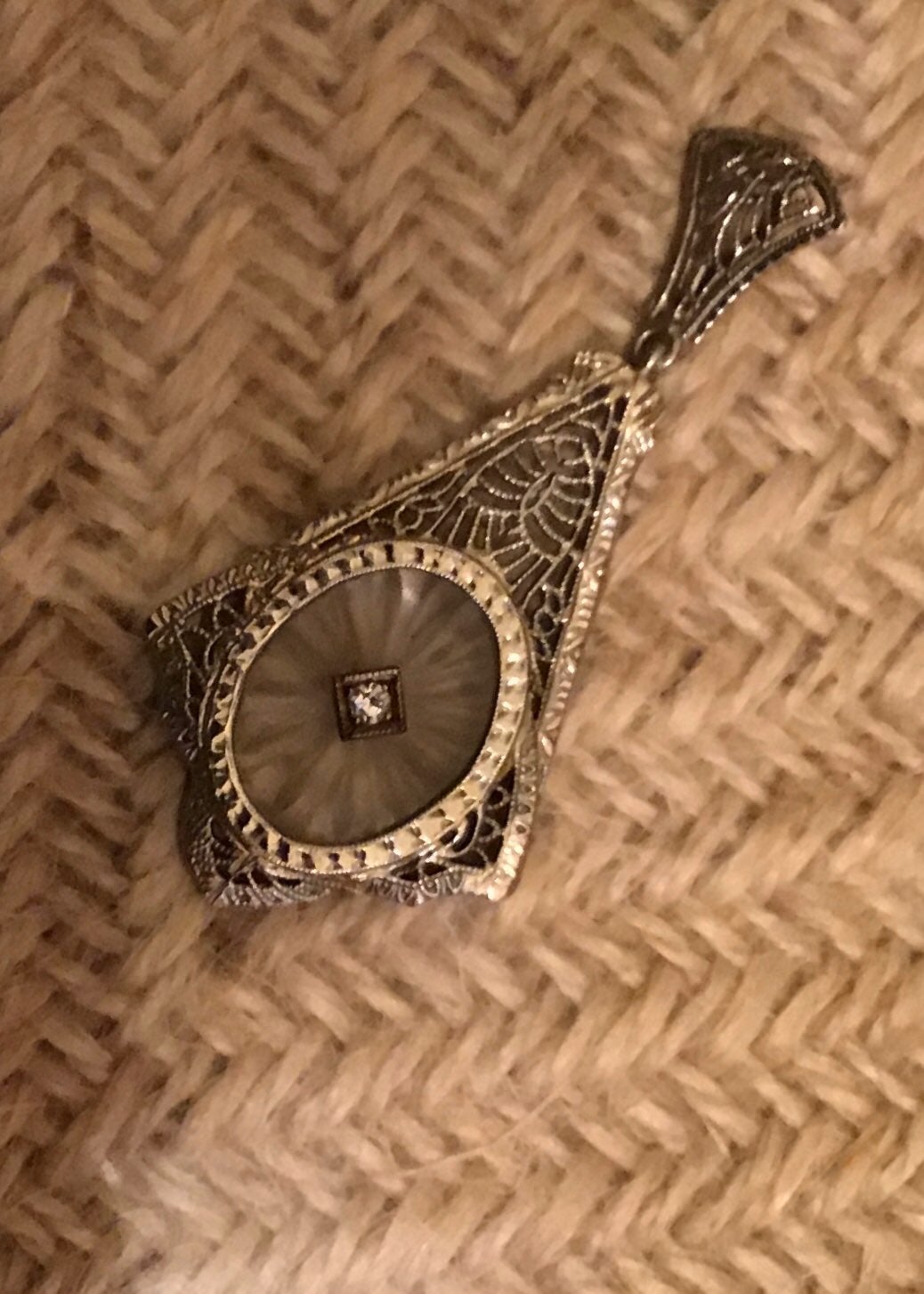 Vintage white gold charm with a diamond