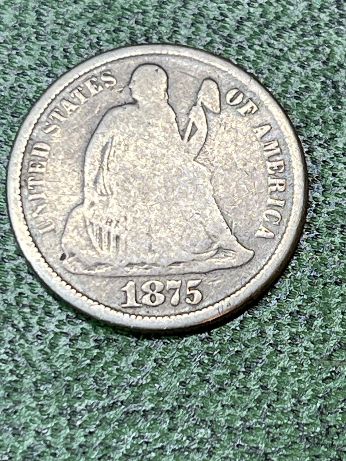 1875 cc, seated liberty dime.