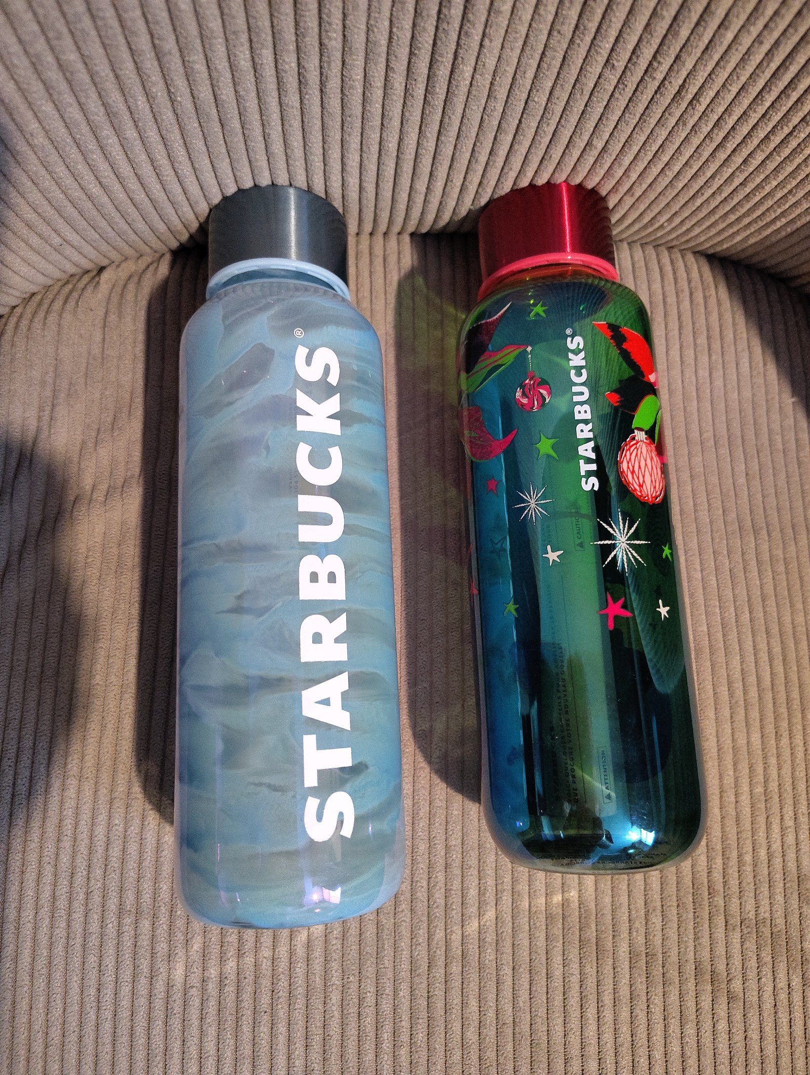 Two glass Starbucks