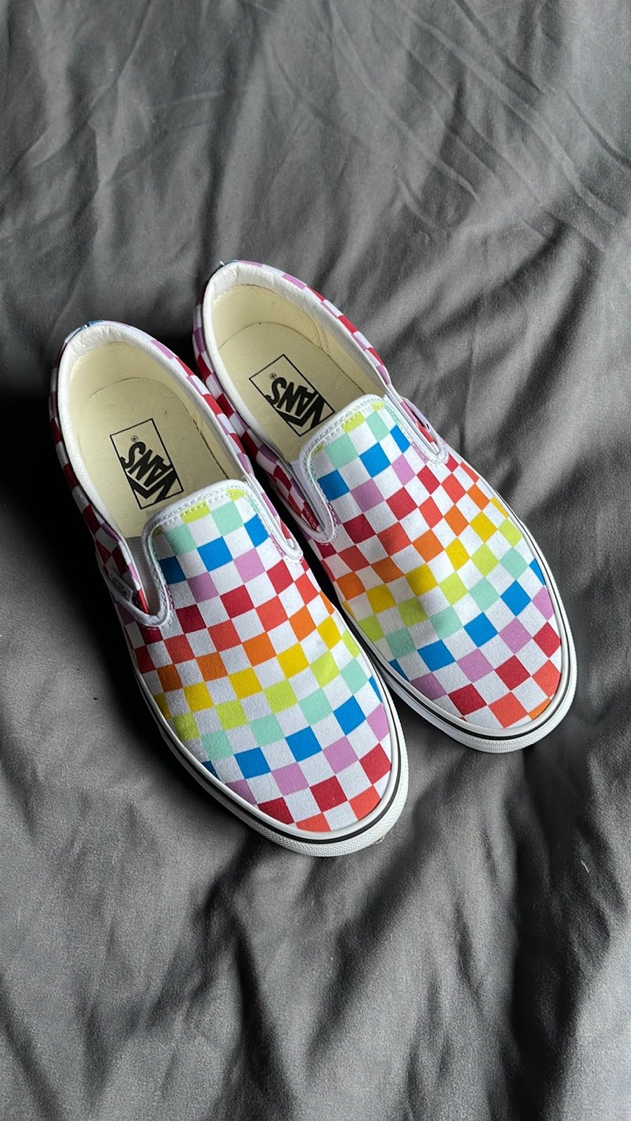 Checkered Vans slip ons