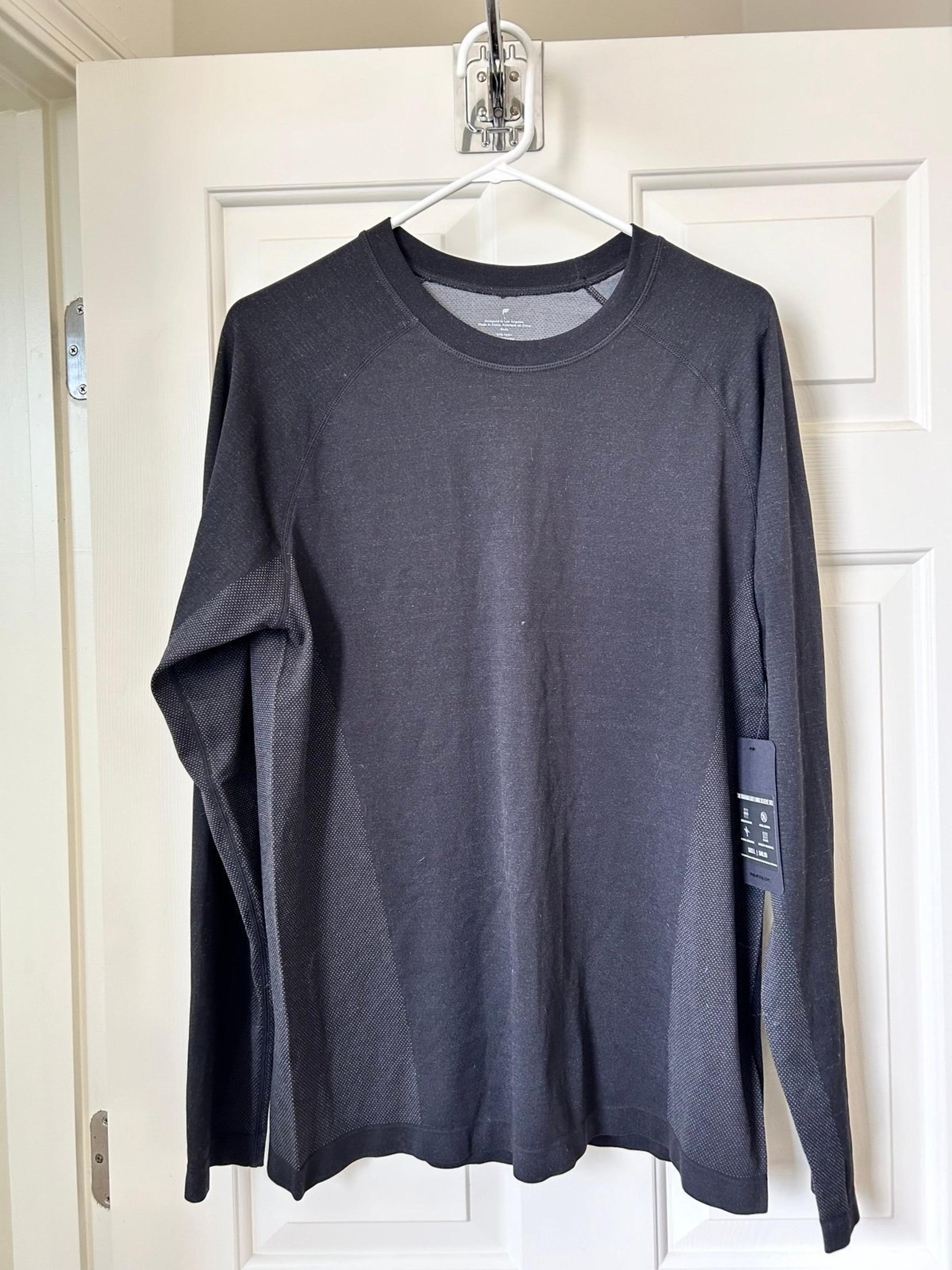 2 Men’s Large Fabletics athletic shirts. Brand New w/tags