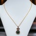 Vintage sterling 4.3carats green emerald, rubies and diamond pendant