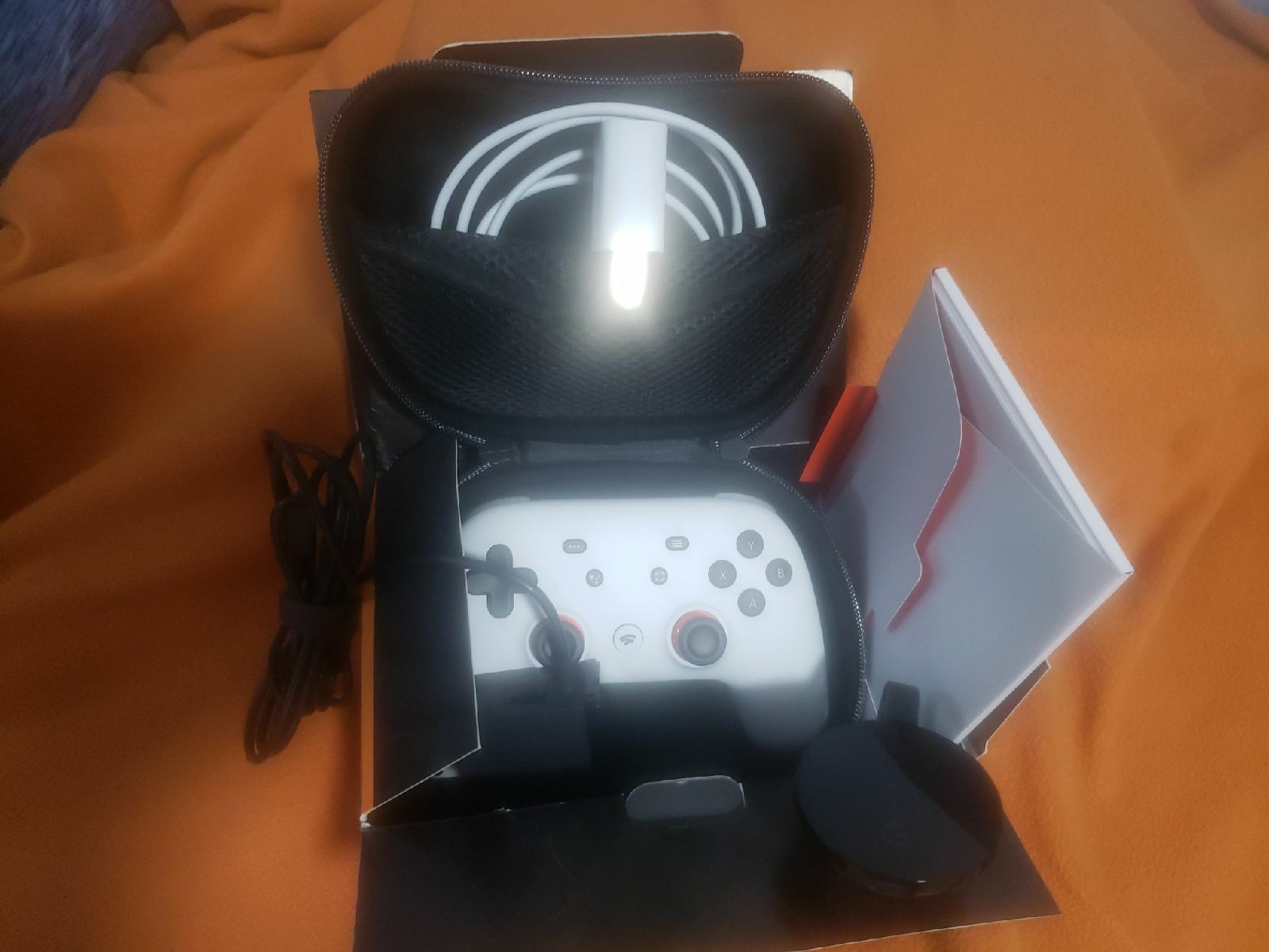 Google stadia pro controller, case and Google home.