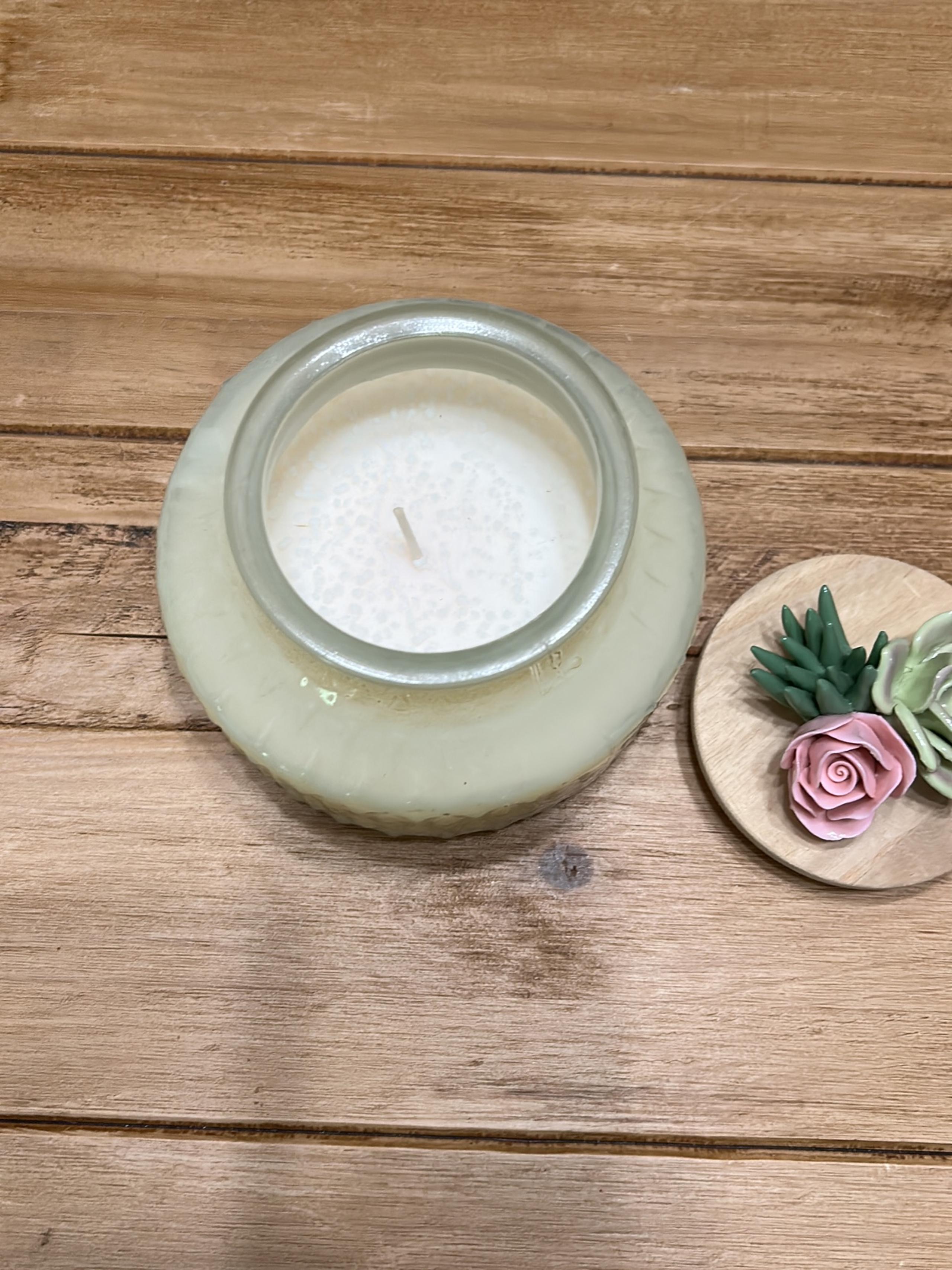 Candle with succulent topper