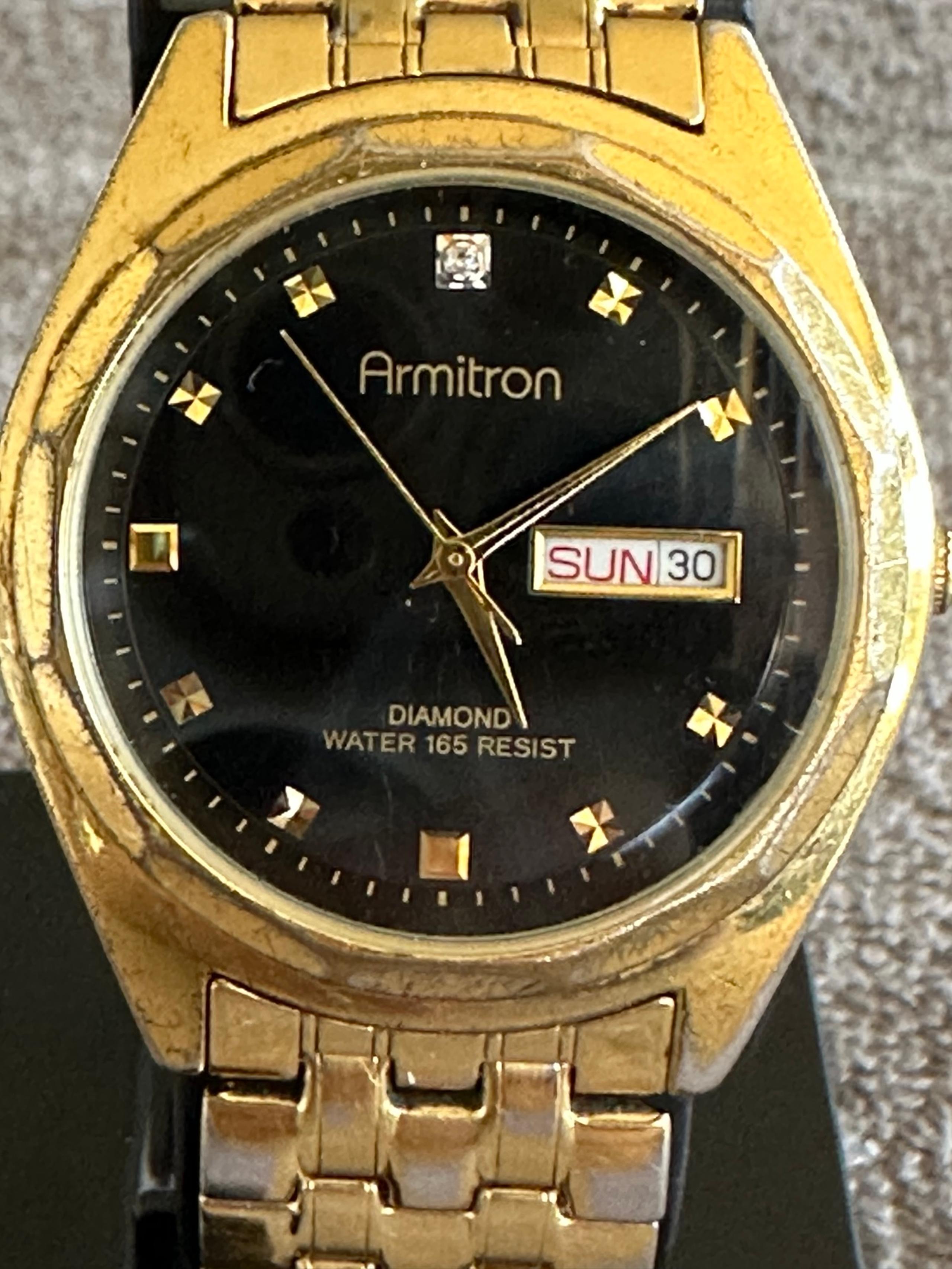 Armitron gold tone, Day-Date's calendar, black dial watch for Men.