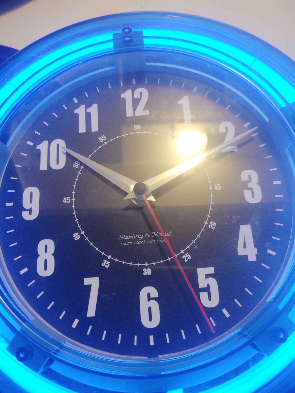 Sterling and nobile neon blue clock
