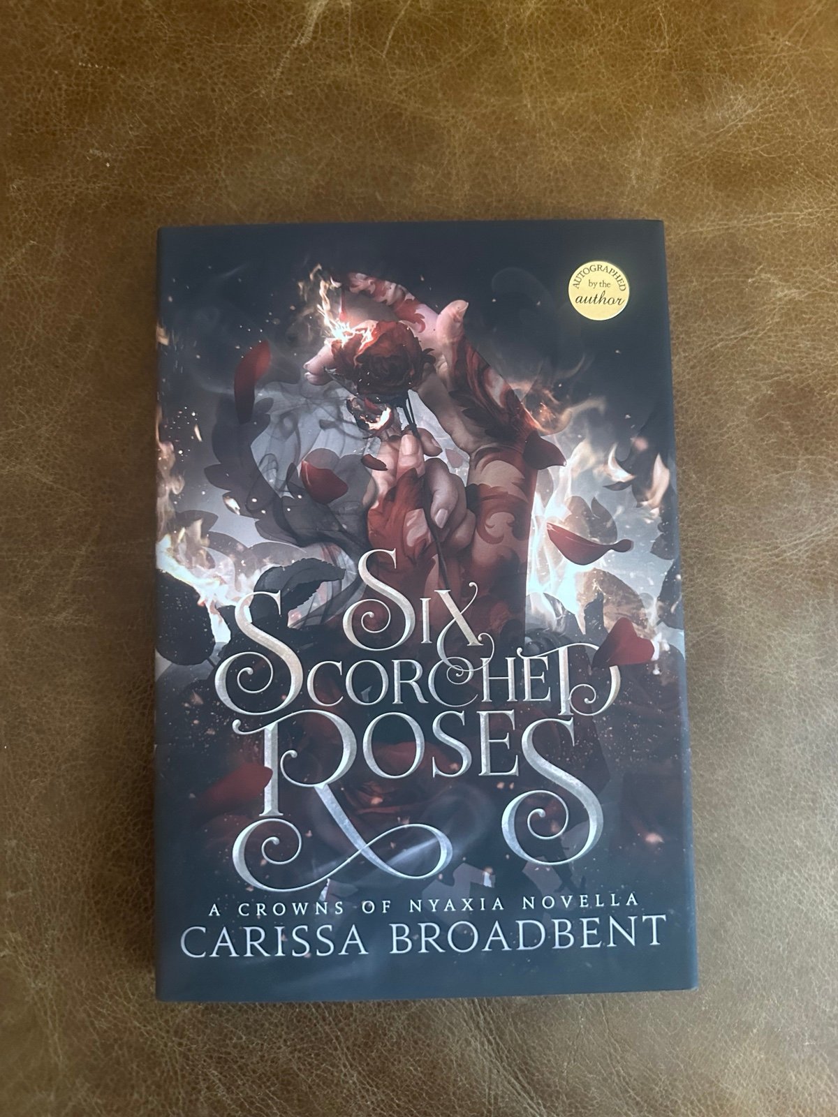 Six scorched roses signed