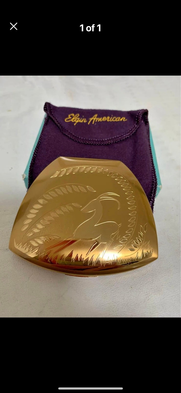 Gorgeous 1950's Elgin American gold tone compact with a gazelle