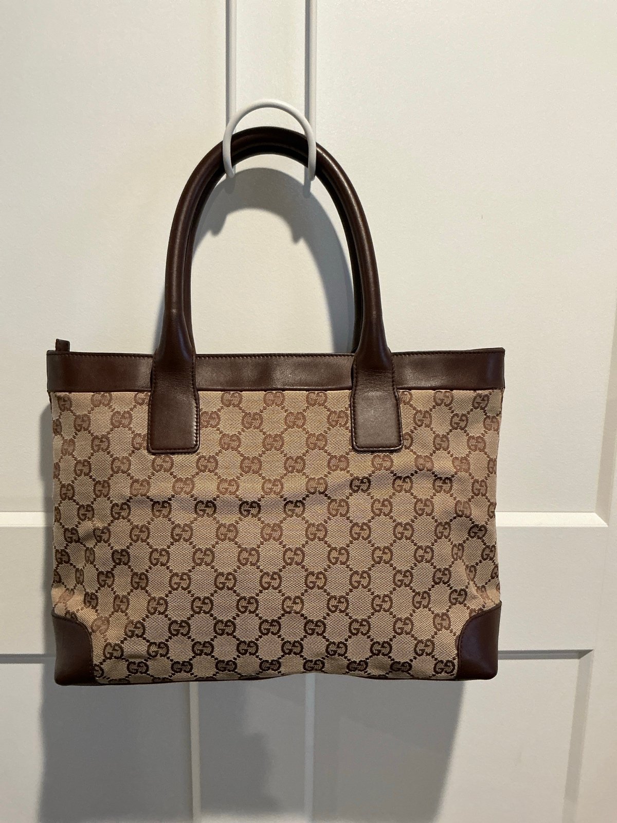 Gucci GG Canvas Tote with Leather Trim around the Top, Handles and Base.