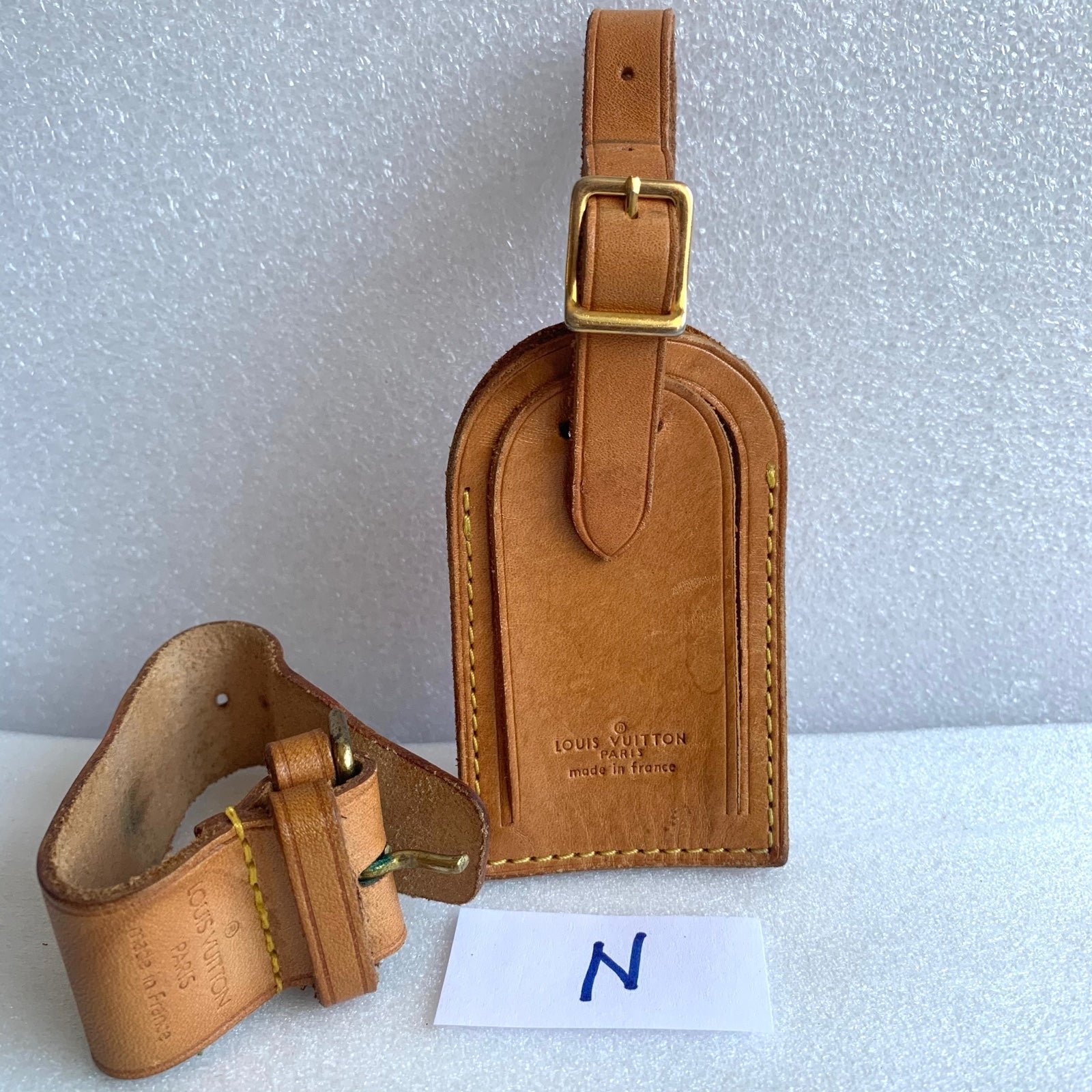 Louis Vuitton luggage tag and poignet