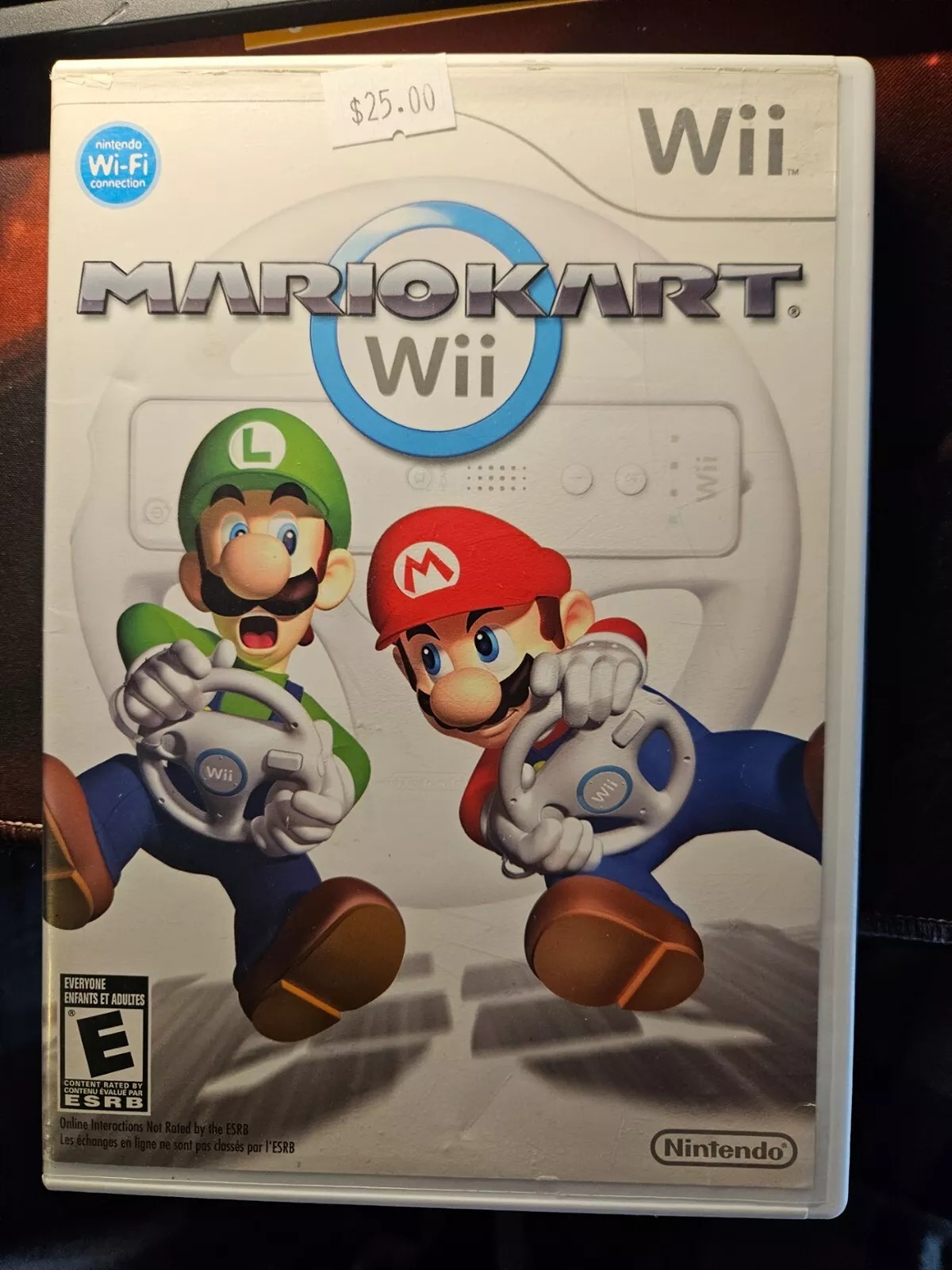1 Mario Kart loose & 1 Mario Kart Wii with Game and Case.