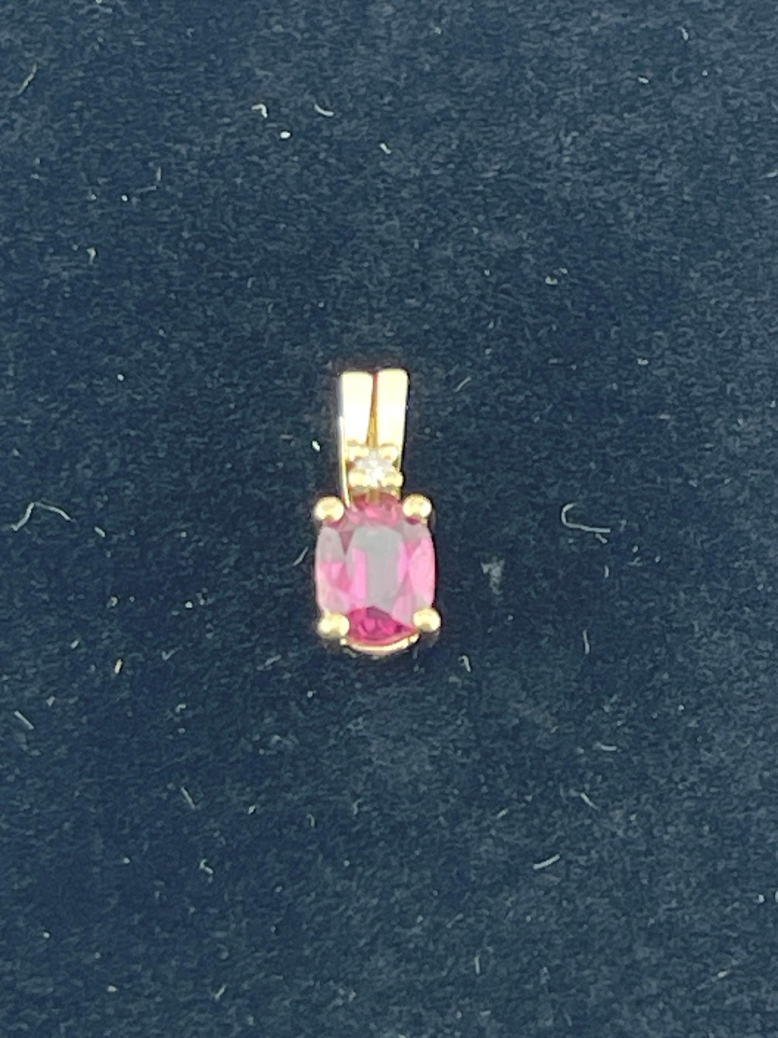 Vintage, natural 1/2 carat ruby and diamond pendant 14 karat yellow gold