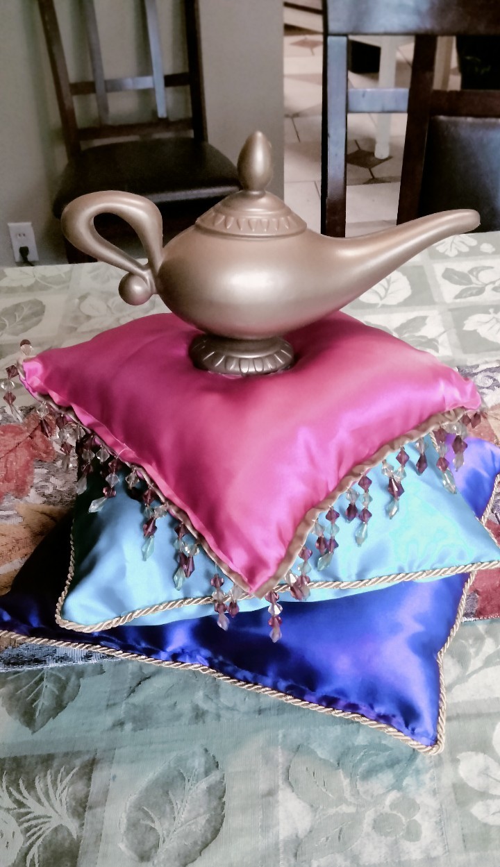 Magic genie lamp on silk pillows