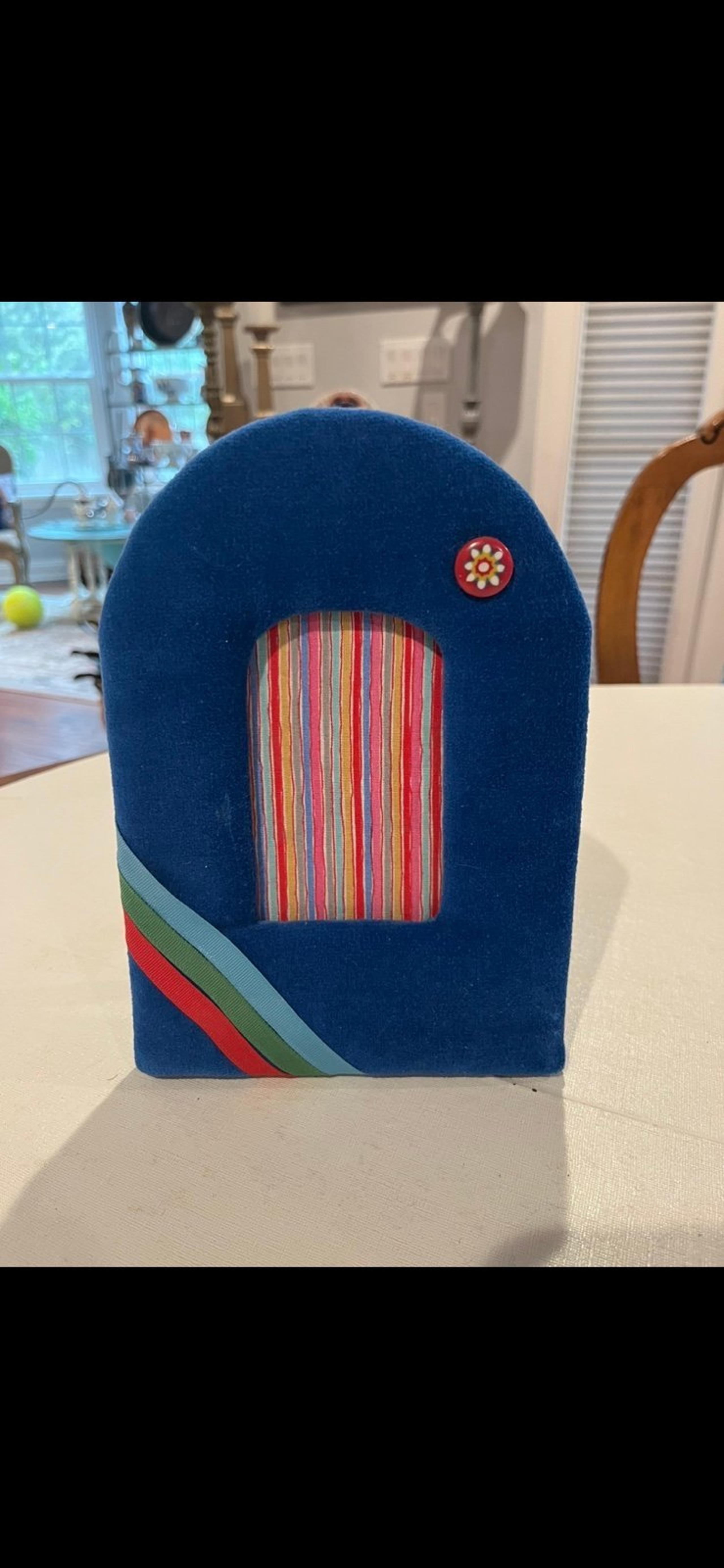 Vintage blue striped and accented plush velour arched picture frame. GUC!