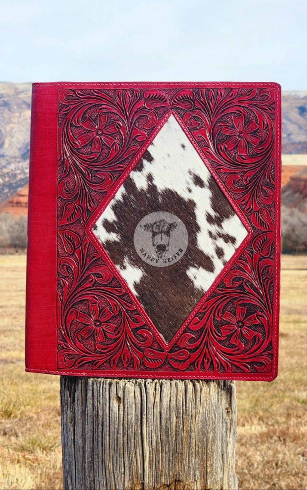 Cowhide and tooled leather portfolio, these portfolio planners are 14x11.5 NWOT