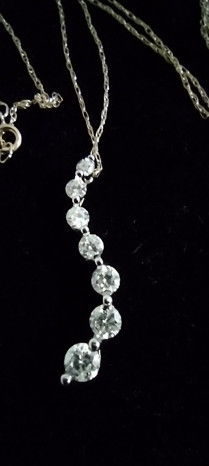 Zales 1CTW diamond Curve pendant in 14K yellow gold .