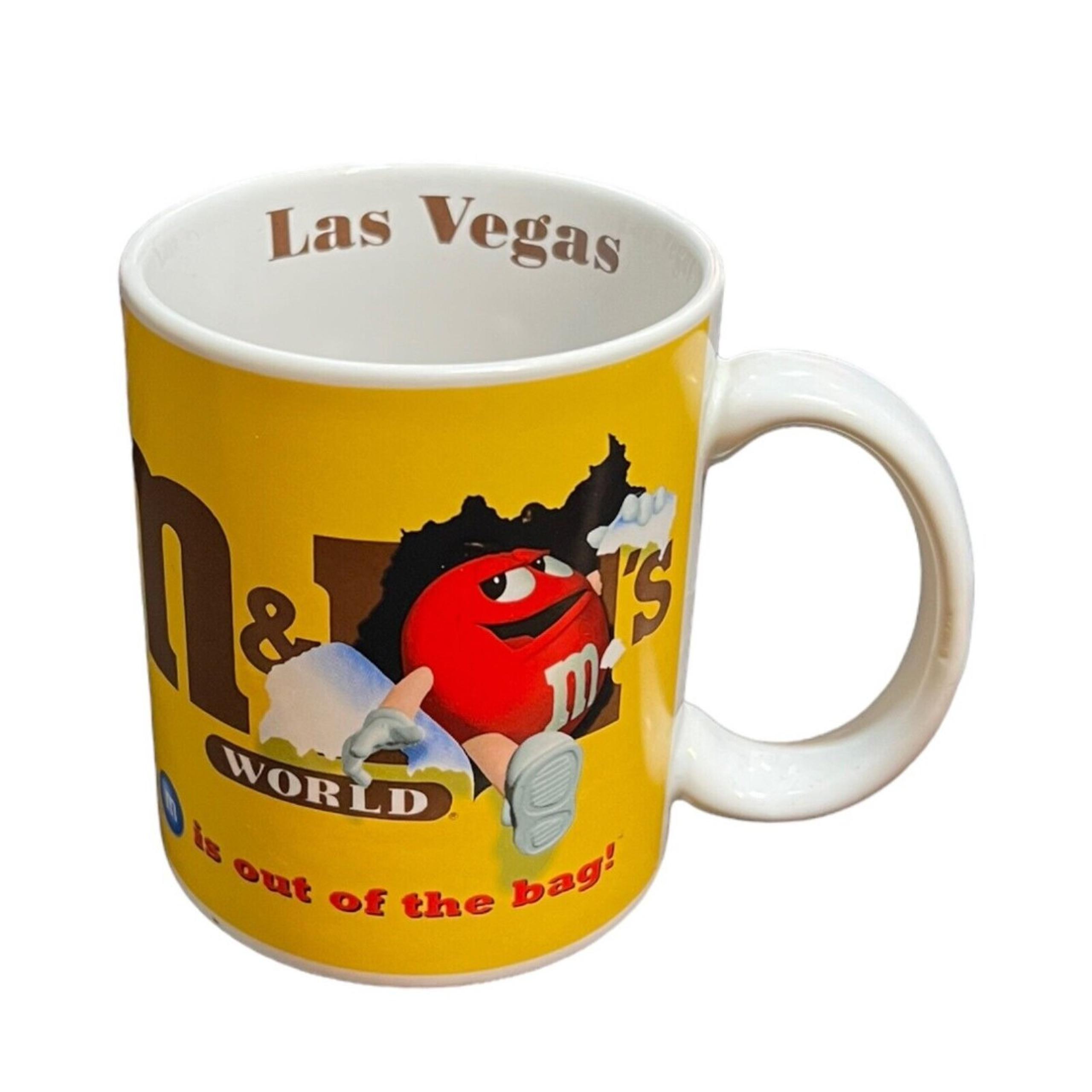 Mars M&M Candy World Las Vegas Coffee Mug Cup "The M is Out Of The Bag!"