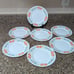 SET OF SEVEN ARCOPAL FRANCE WILDFLOWER PLATES 7.75