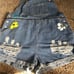 Jean overalls with pockets and hand painted daisies distressed look. Says 3x bu