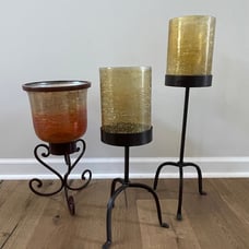 TRIO OF LARGE AMBER HURRICANE LAMPS WITH STANDS