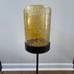 TRIO OF LARGE AMBER HURRICANE LAMPS WITH STANDS