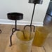 TRIO OF LARGE AMBER HURRICANE LAMPS WITH STANDS