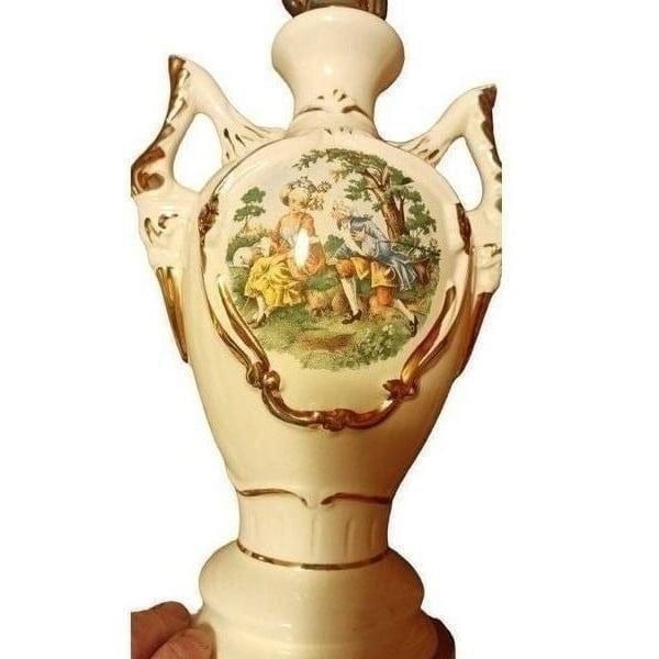 Vintage lido china lamp with Victorian art work. In good condition