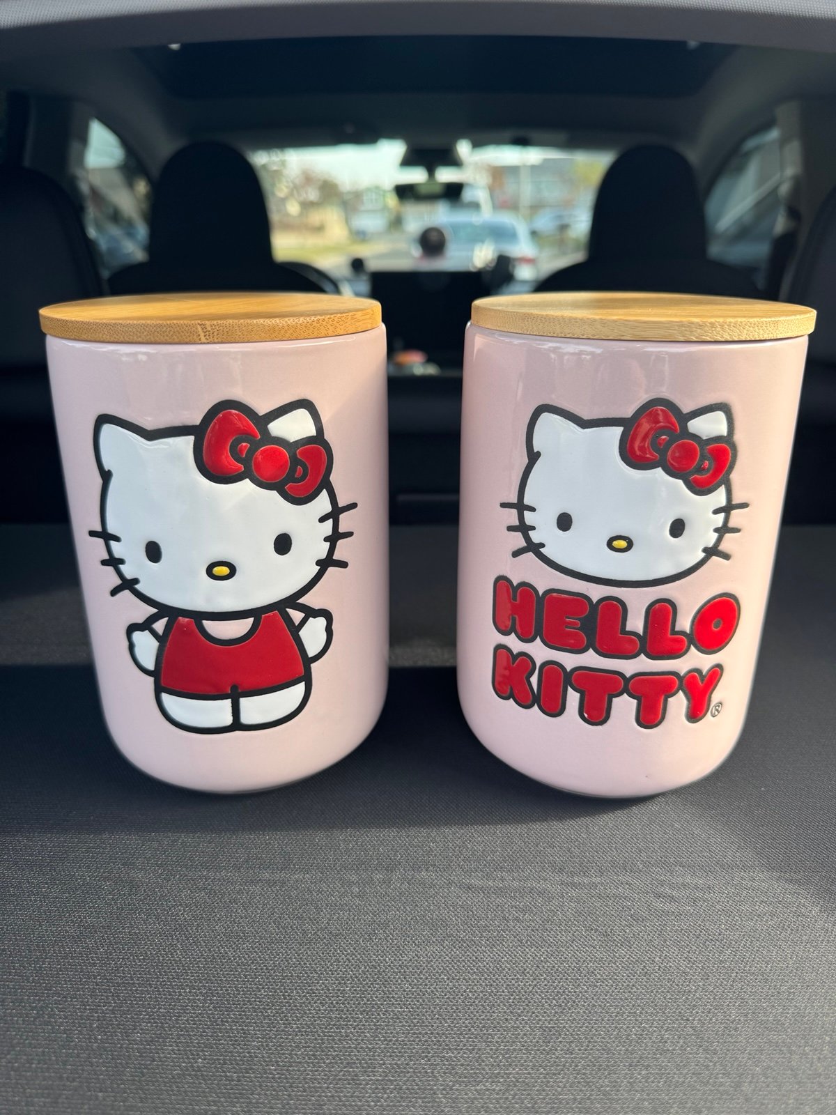 2 Hello Kitty ceramic Jars with wooden lids
