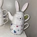 Whimsical cupboard three-piece bunny tea set