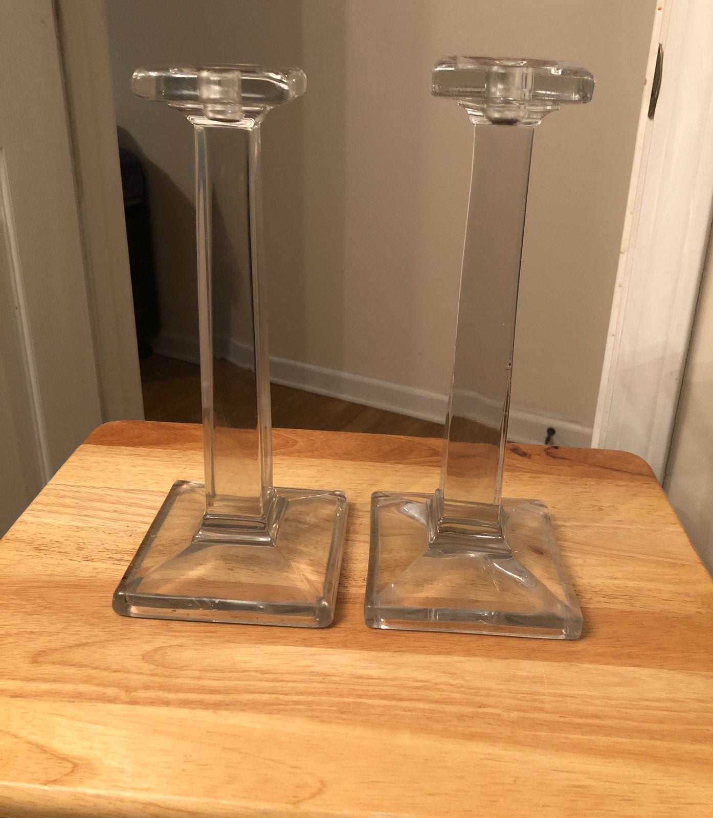 Two VTG tall glass candlestick holders