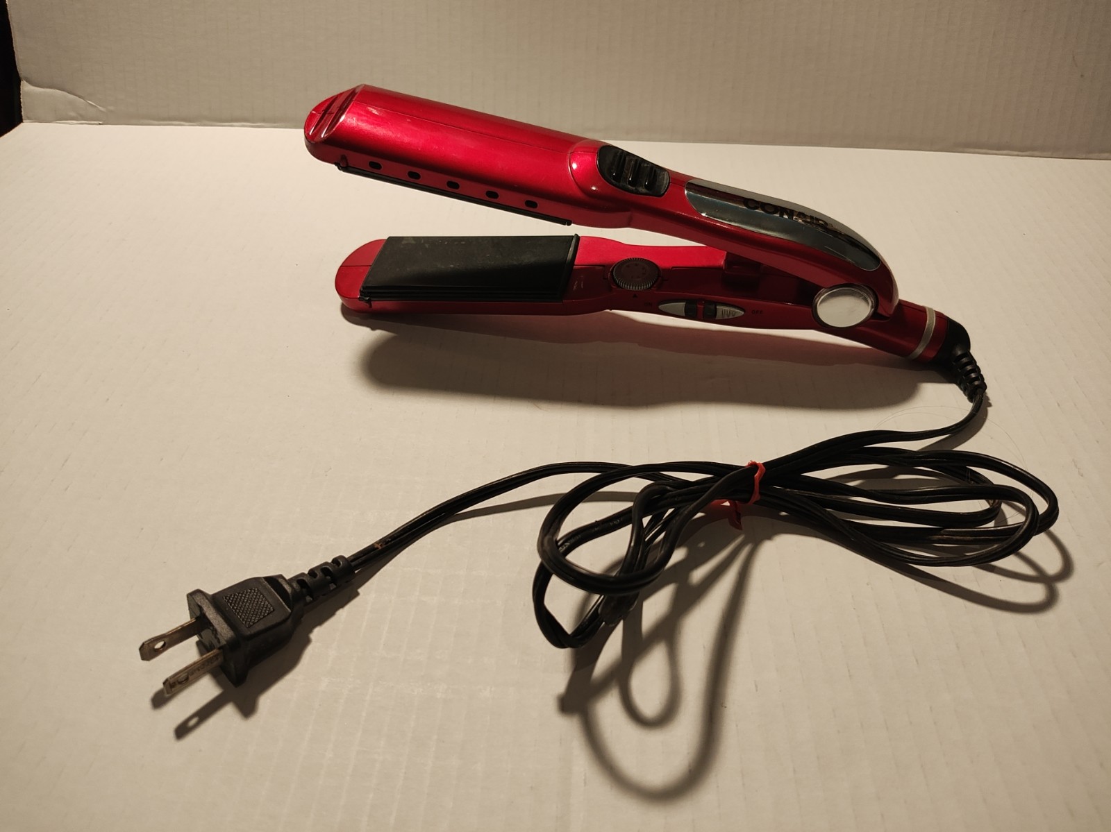 Red Conair flat iron hair straightener