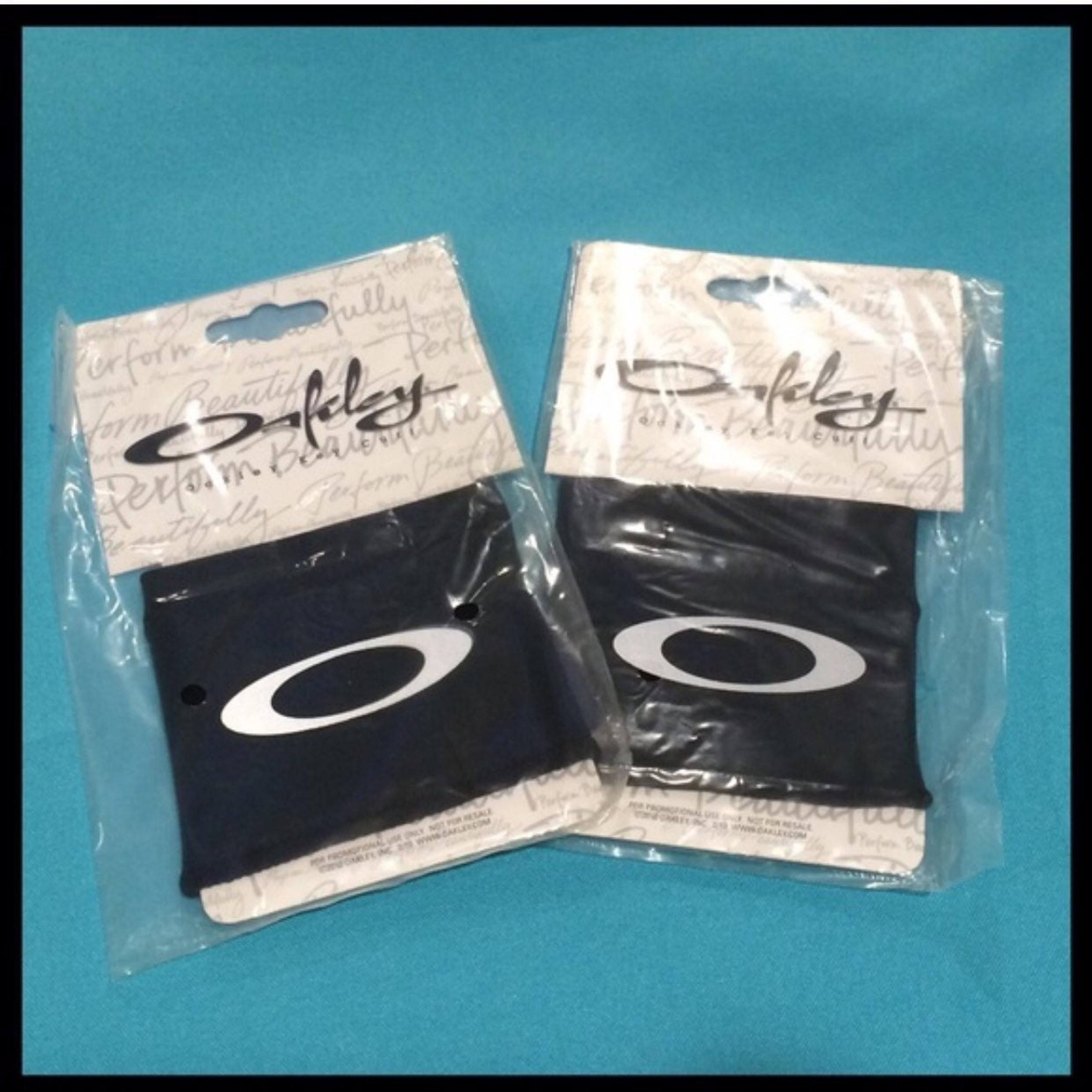 2 OAKLEY Exercise Key Cuffs Wrist Bands