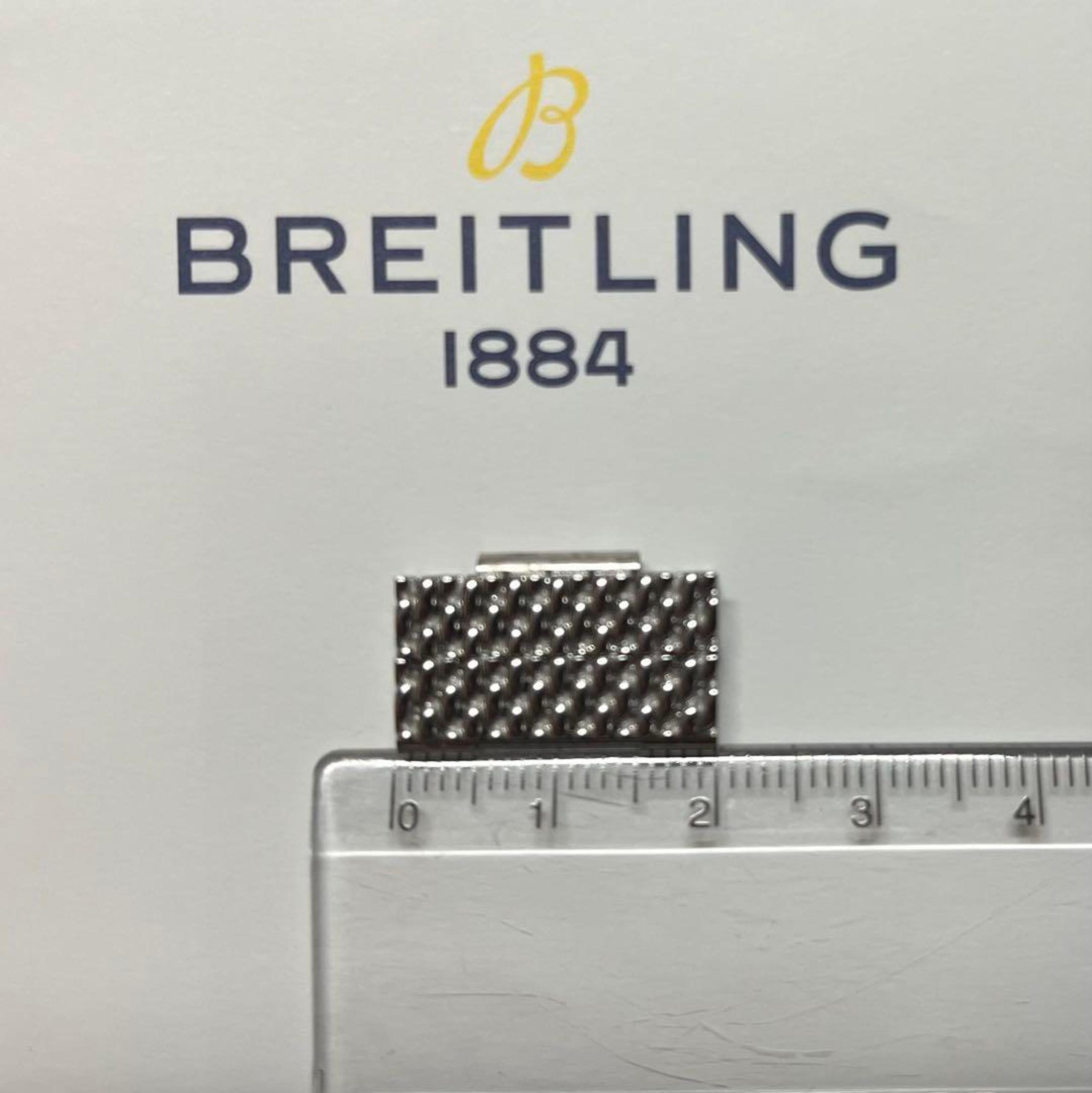 Two links for a Breitling Milanese bracelet.