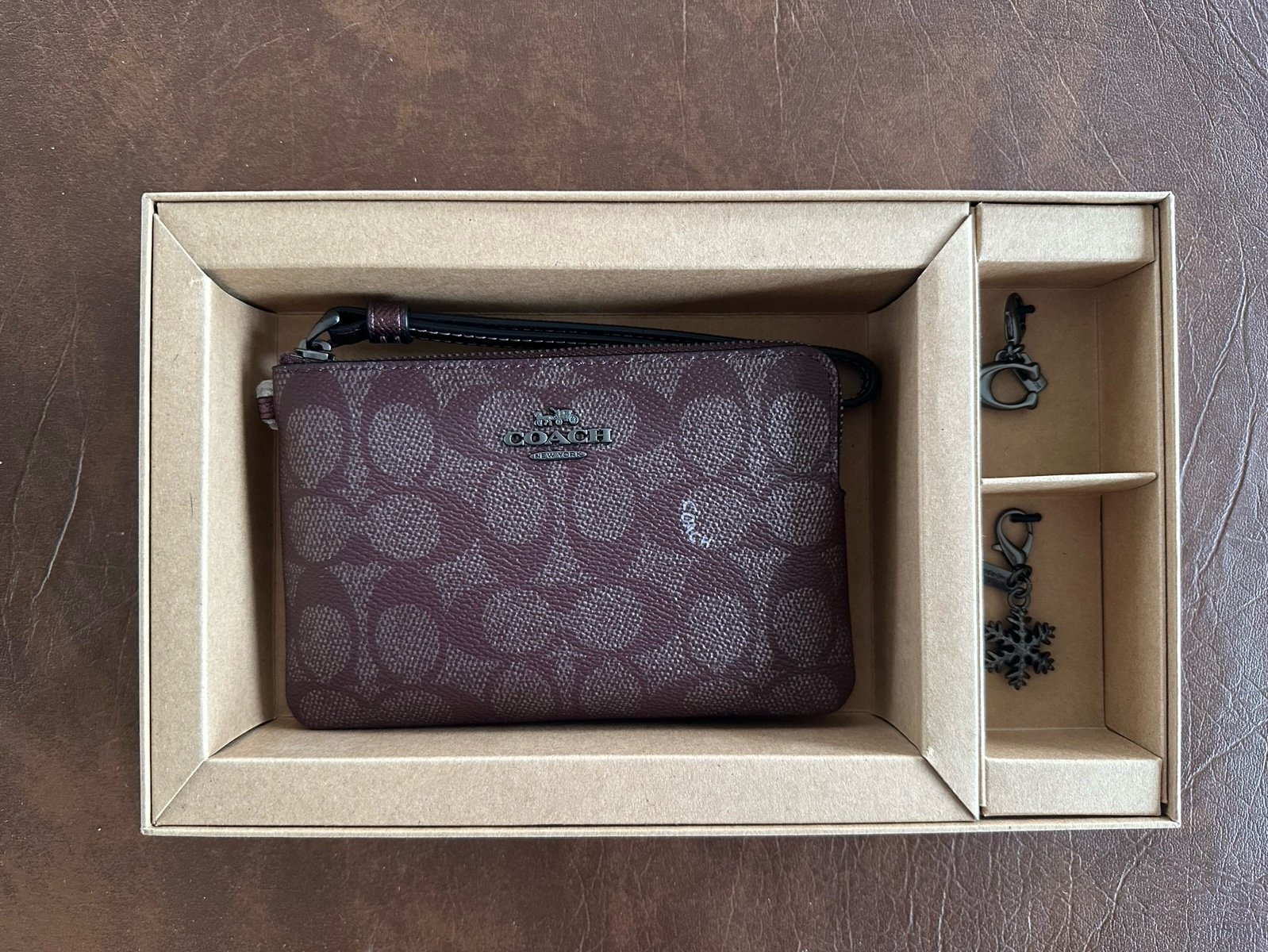 Boxed Corner Zip Wristlet In Signature Canvas With Charms
