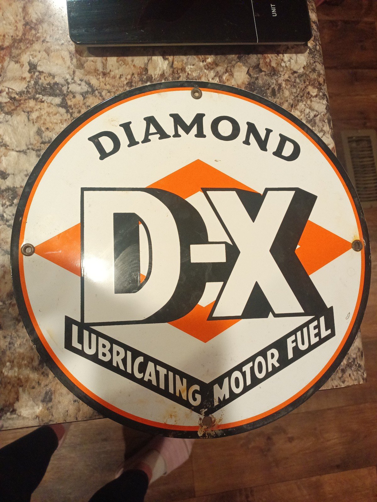 Vintage Diamond DX Lubricating motor oil sign.