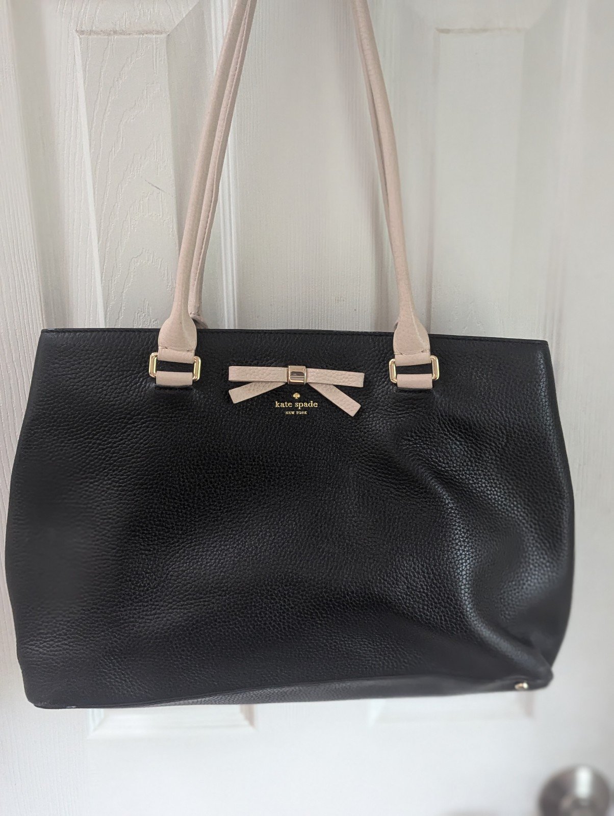 Black Kate Spade bag with bow