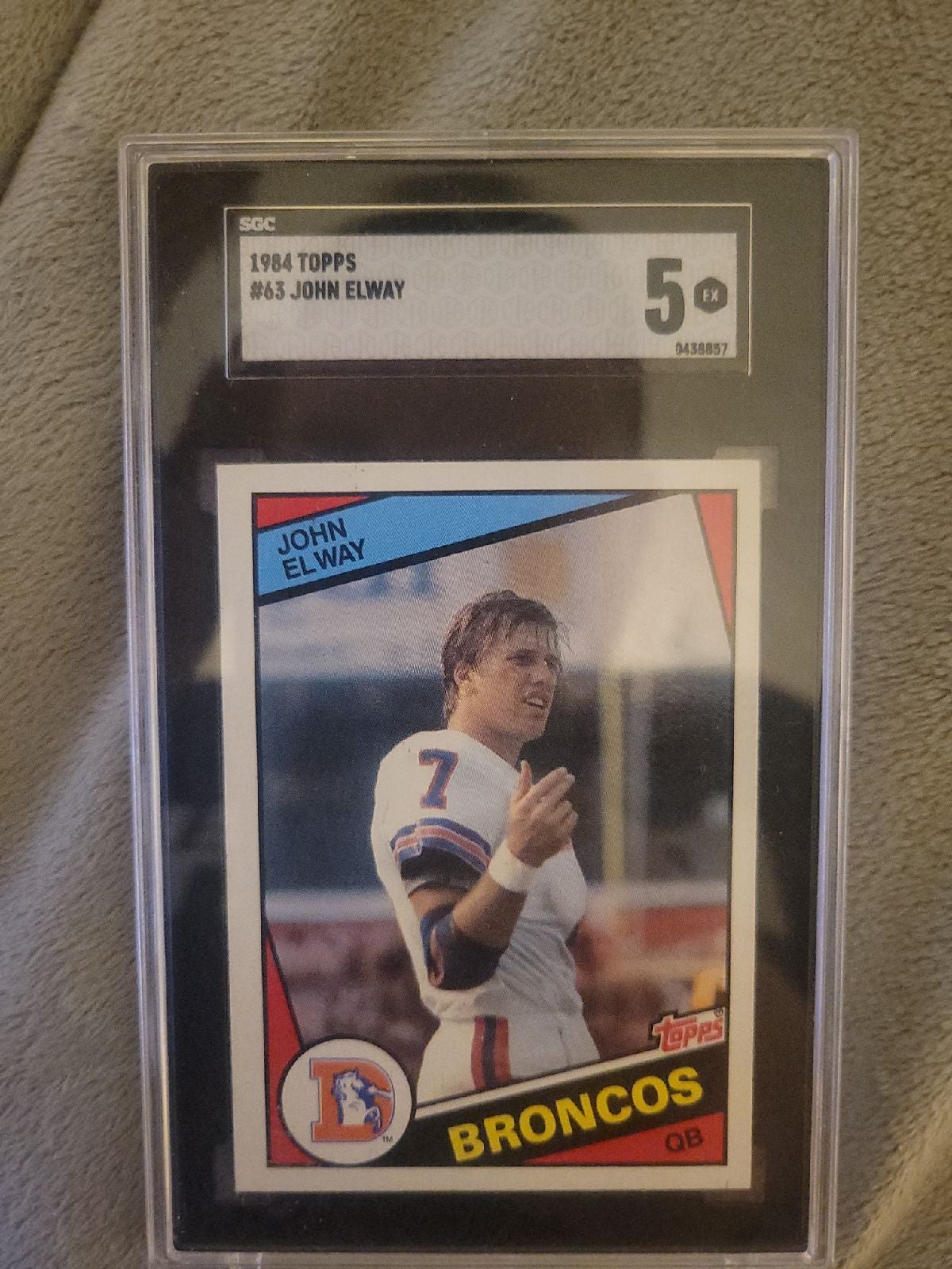 Topps Elway original rookie card graded at a 5 because the sides are uneven. Jus