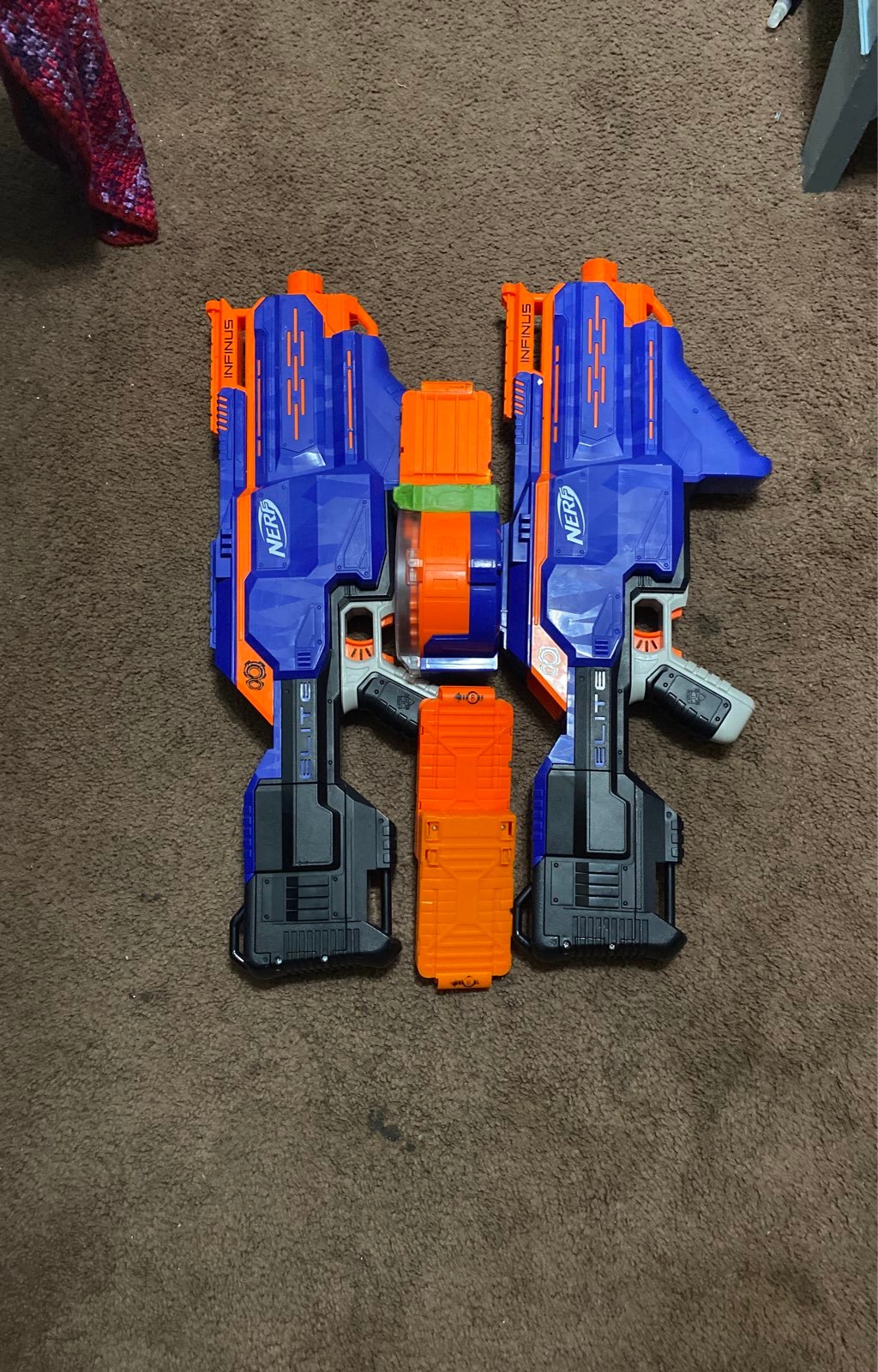 Two nerf infinus blasters with magazines