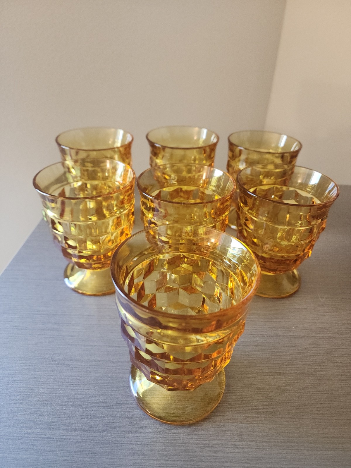 Set of 7 Indiana Amber Whitehall Cubist Pattern Juice glasses/ tumblers.