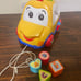 Rhymes and sorter car for toddler. Spanish language toy.