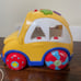 Rhymes and sorter car for toddler. Spanish language toy.