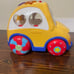 Rhymes and sorter car for toddler. Spanish language toy.