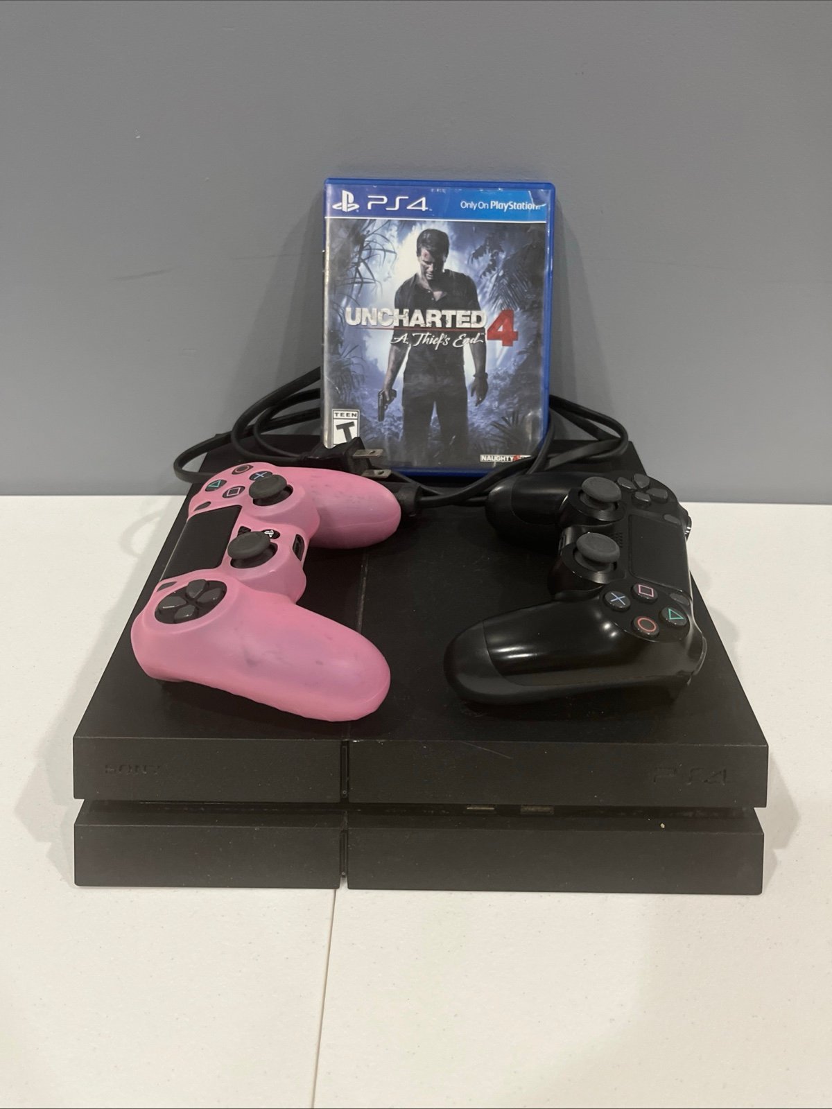 PlayStation 4 with 2 controllers and game
