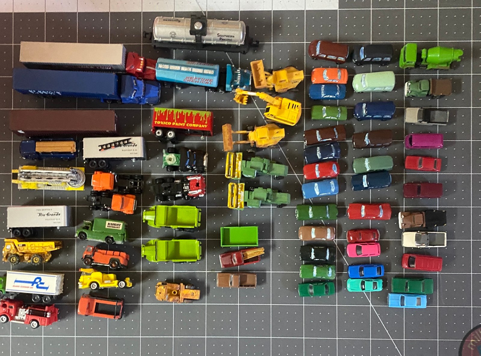 Vintage miniature cars, trucks, farm equipment & busses. 66pcs
